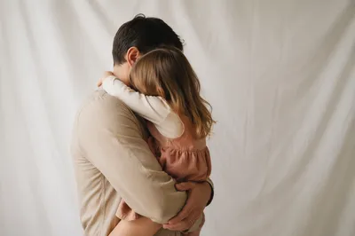 Tender Father Daughter Embrace in Soft Light
