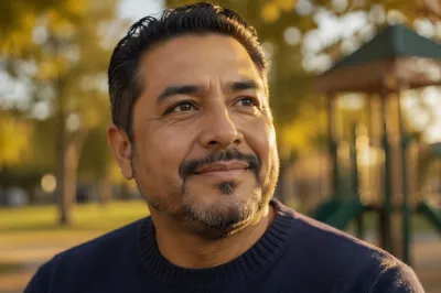 Proud Smiling Father in Autumn Park
