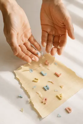 Forgiveness Hands Releasing Pastel Letters