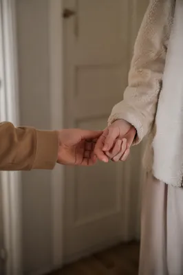 Forgiving Hands in Warm Hallway Light