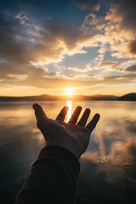 Open Hand Releasing Burdens at Sunset