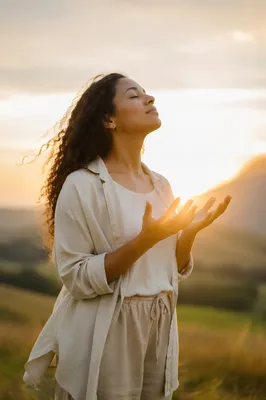 Woman Releasing Hands in Sunrise Meadow