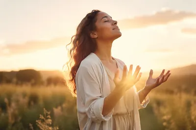 Woman Releasing Hands in Sunrise Meadow