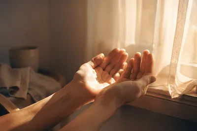 Open Hands Receiving Morning Sunlight