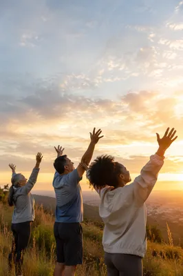 People Raising Hands on Sunrise Hill