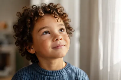 Hopeful Child Looking Up in Wonder