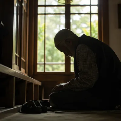 Humble Elder Bowing in Gentle Window Light