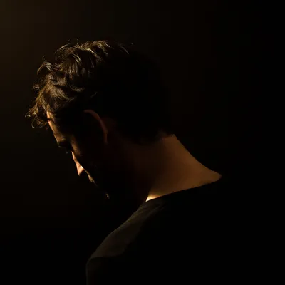 Humble Bowed Head in Gentle Light