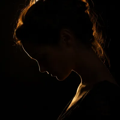 Humble Bowed Head in Gentle Golden Light