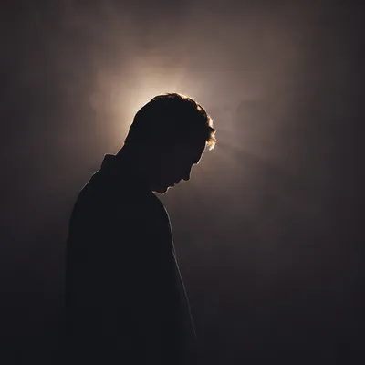 Humble Bowed Silhouette in Gentle Light