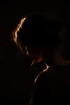 Humble Bowed Head in Gentle Golden Light