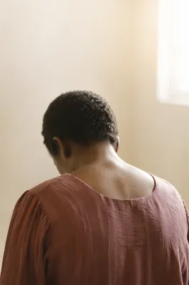 Humble Bowed Head in Gentle Light