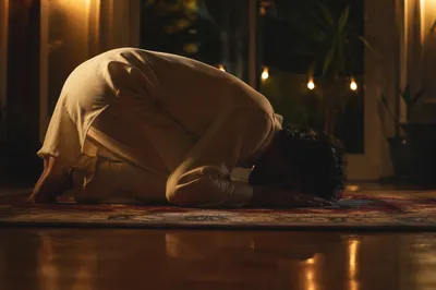 Humble Bowed Prayer in Gentle Dusk Light