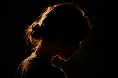 Humble Bowed Head in Gentle Golden Light