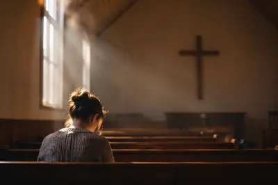 Humble Prayer in Gentle Chapel Light