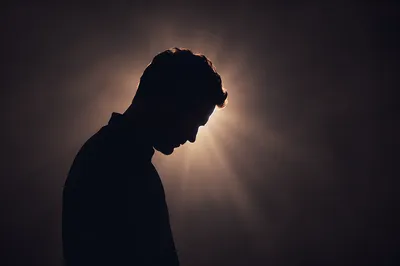 Humble Bowed Head in Gentle Light