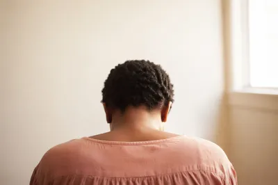 Humble Bowed Head in Gentle Light