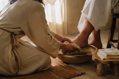 Humble Foot Washing in Morning Light
