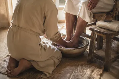 Humble Foot Washing in Morning Light