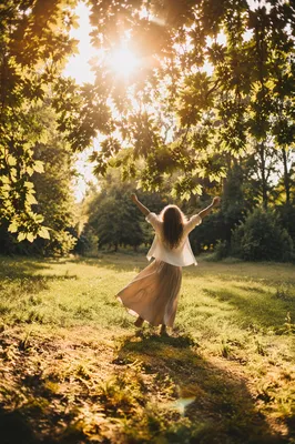 Joyful Twirl Beneath Summer Sunlight