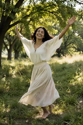 Joyful Woman Twirling in Sunlit Meadow