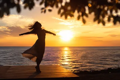 Joyful Sunset Dance by the Ocean