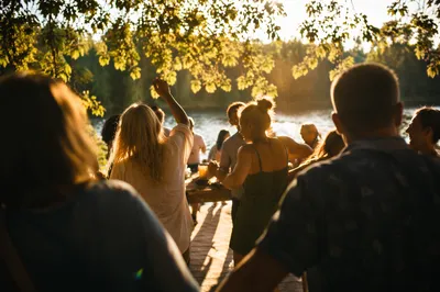 Joyful Lakeside Dancing in Sunlit Forest