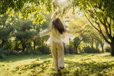 Joyful Sunlight Through Leaves in Park