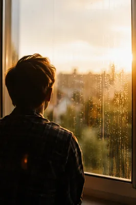 Lonely Figure at Rainy Window