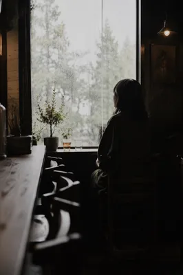 Solitary Figure by Rainy Cafe Window