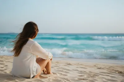 Solitary Beach Reflection Toward Ocean Horizon