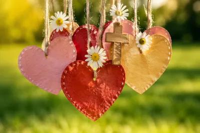 Paper Hearts and Cross in Sunlit Garden