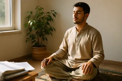 Peaceful Young Man Meditating by Window
