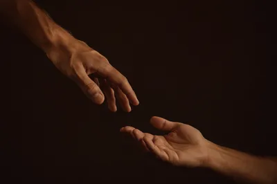 Mercy Hands Reaching Down in Compassion