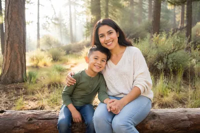 Mother and Son in Forest Clearing