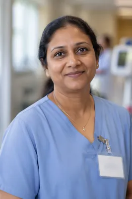 Compassionate Nurse Headshot in Hospital Corridor