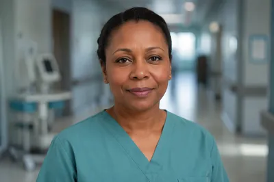 Compassionate Nurse Headshot in Hospital Corridor