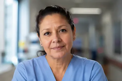 Compassionate Nurse Headshot in Hospital Corridor