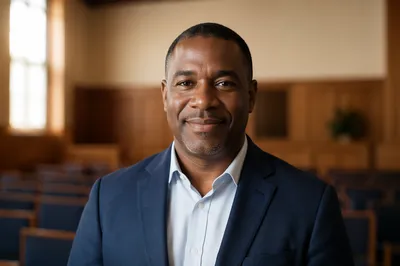 Warm Portrait of Smiling Pastor