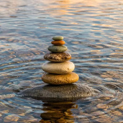 Peaceful River Stones in Still Water