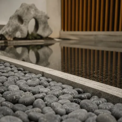 Peaceful Stones Beside Still Reflecting Water