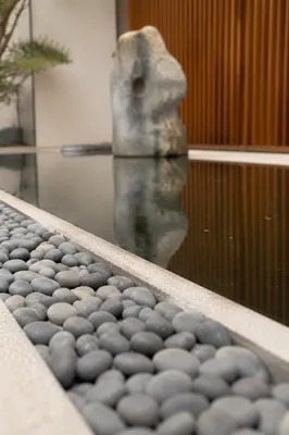 Peaceful Stones Beside Still Reflecting Water