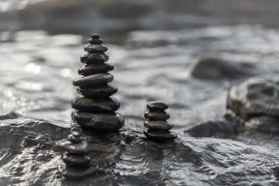 Peaceful Stone Cairns Beside Still Water