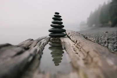 Peaceful Stone Balance by Still Water