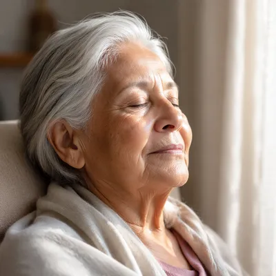 Peaceful Elderly Woman by Sunlit Window