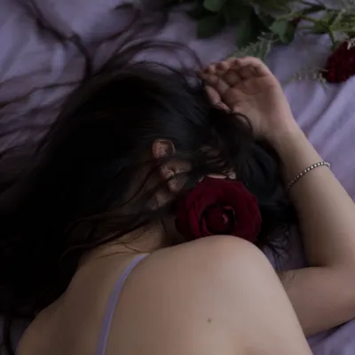 Peaceful Resting Portrait with Rose Accent