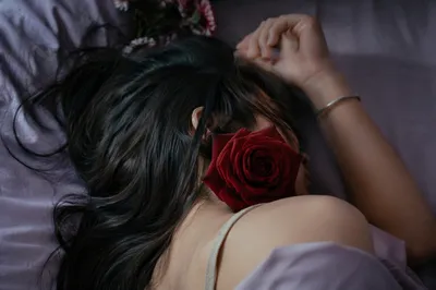 Peaceful Resting Portrait with Red Rose