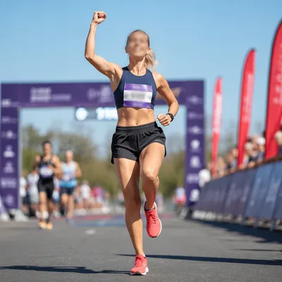 Determined Runner Crossing Finish Line
