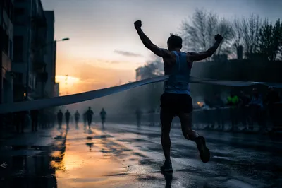 Persevering Runner Crossing Dawn Finish Line