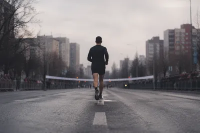 Lone Runner Persevering Toward Distant Finish